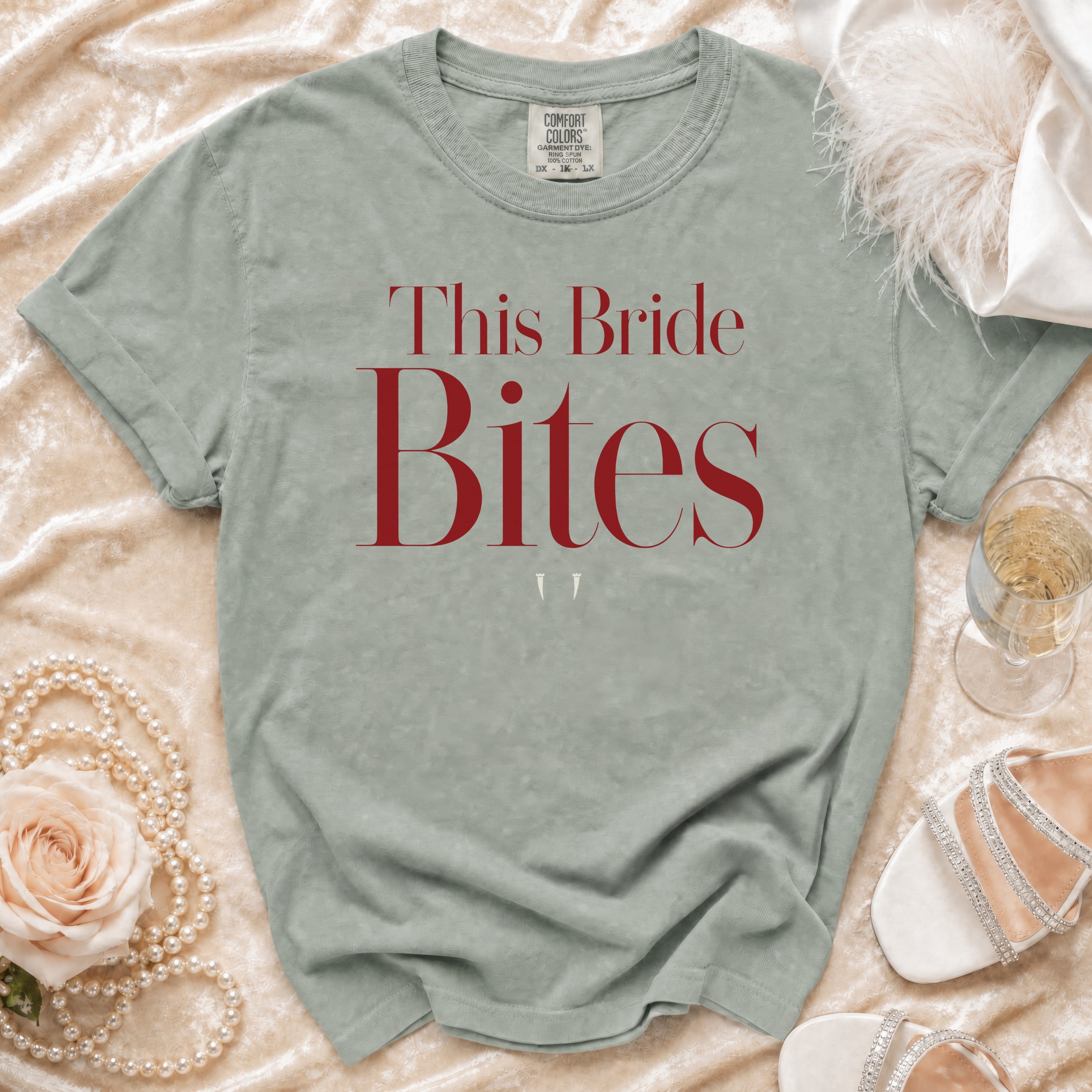 Sage green t-shirt with "This Bride Bites" in red text.