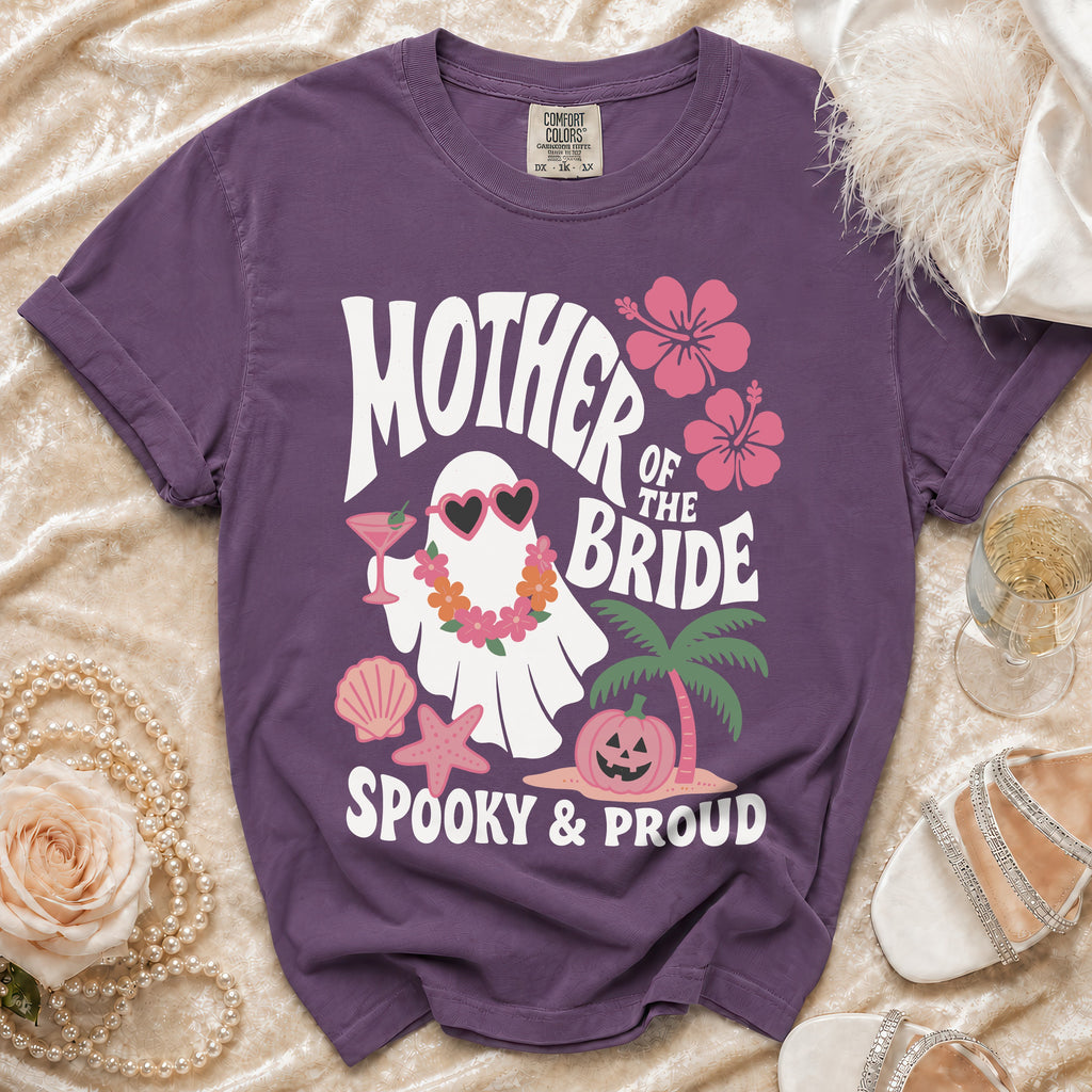 Purple t-shirt with "Mother of the Bride Spooky & Proud" text and ghost graphic.