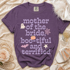 Purple t-shirt with "Mother of the Bride, Boo-tiful and Terrified" text and Halloween graphics.