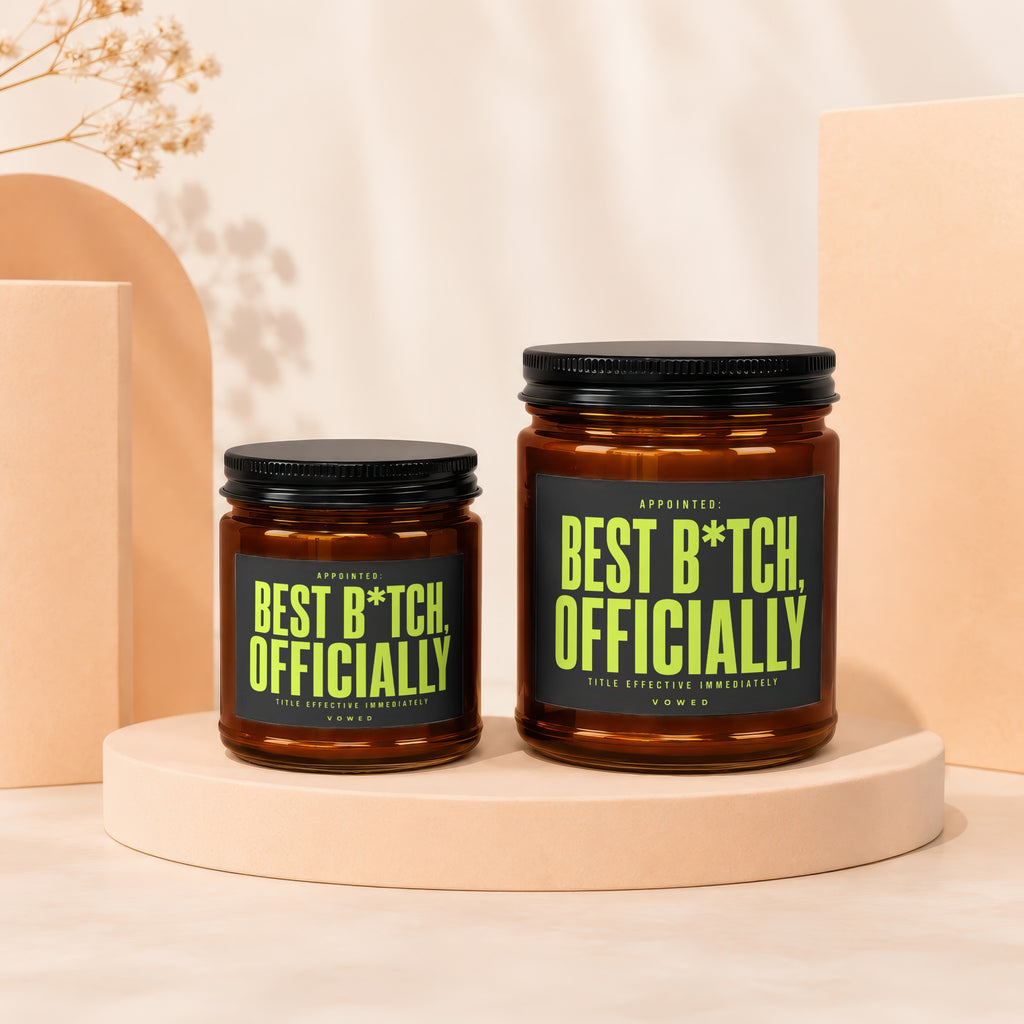 Two amber glass jars with black lids, labels read "Appointed: Best B*tch, Officially".