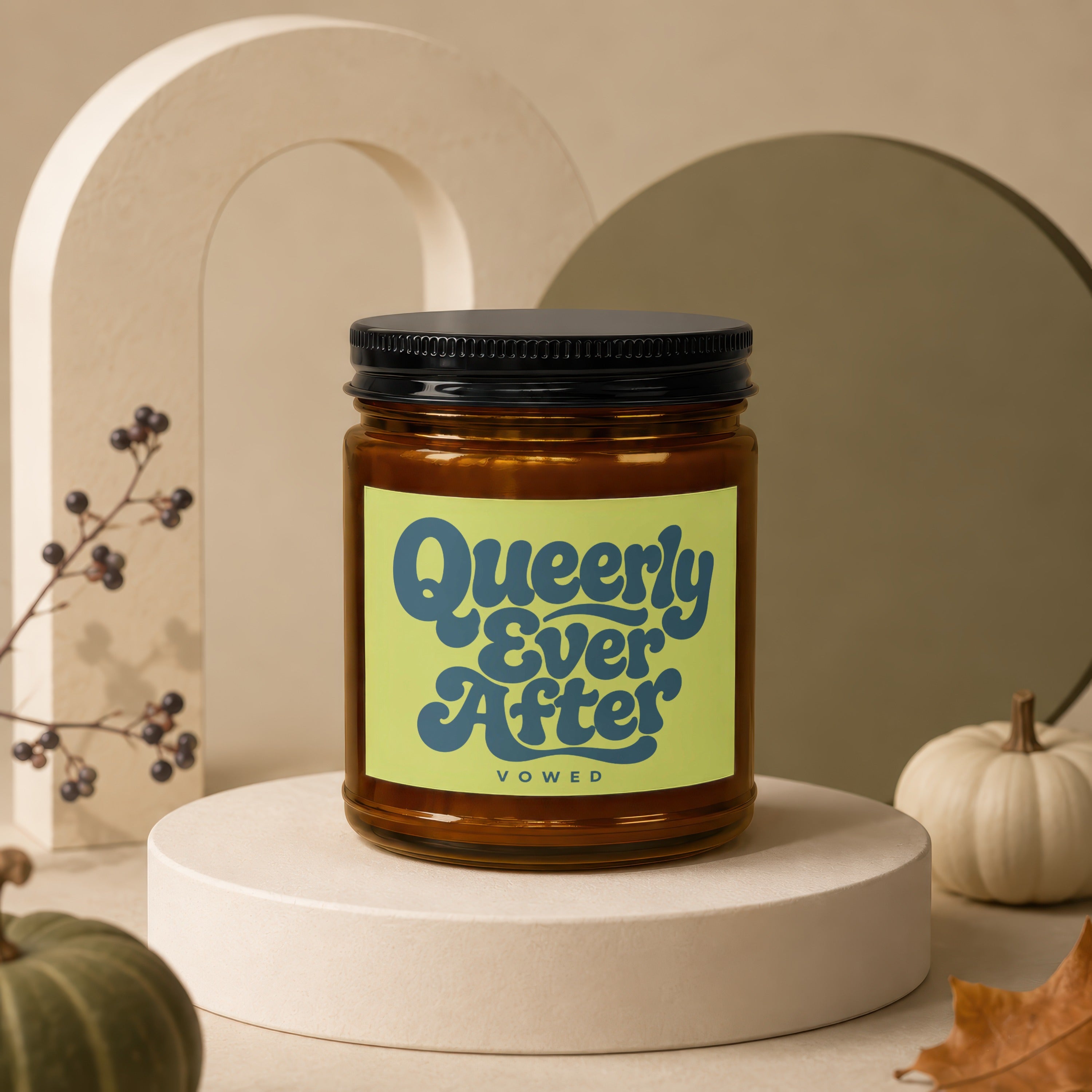 Amber jar candle with black lid and "Queerly Ever After" Vowed label.