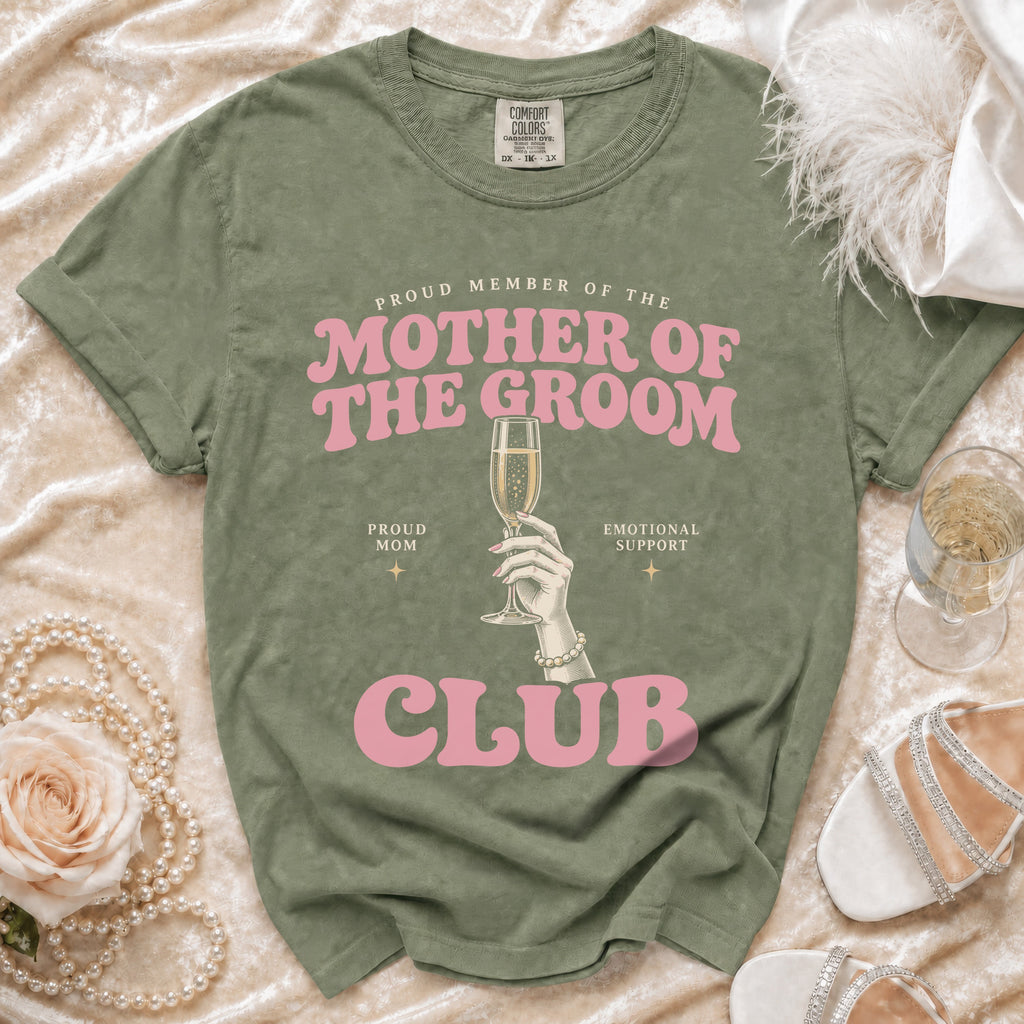 Green t-shirt with "Mother of the Groom Club" text and champagne glass graphic.