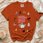 Orange t-shirt with "Mother of the Boo" Halloween graphic and assorted icons.