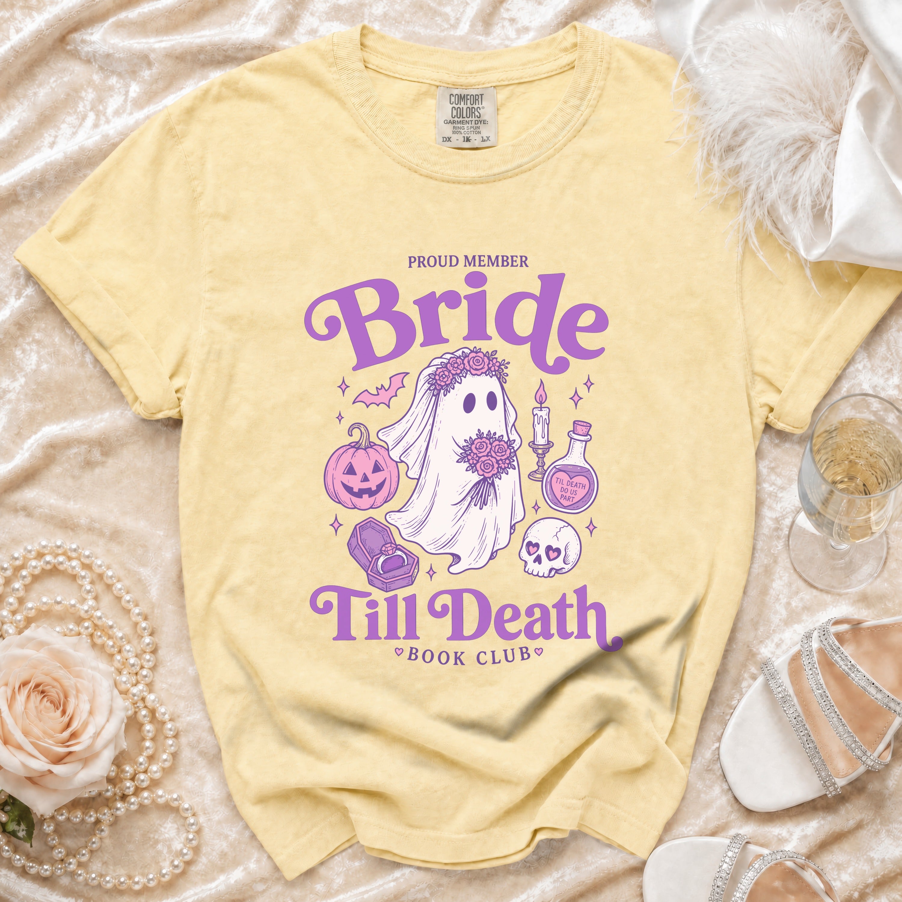 Yellow t-shirt with "Proud Member Bride Till Death Book Club" text and spooky bride graphics.
