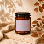Amber candle with lid reads "Married my best friend" on a pink label.