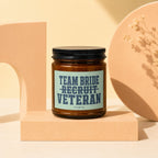 Candle with "Team Bride Recruit Veteran" text on the label.