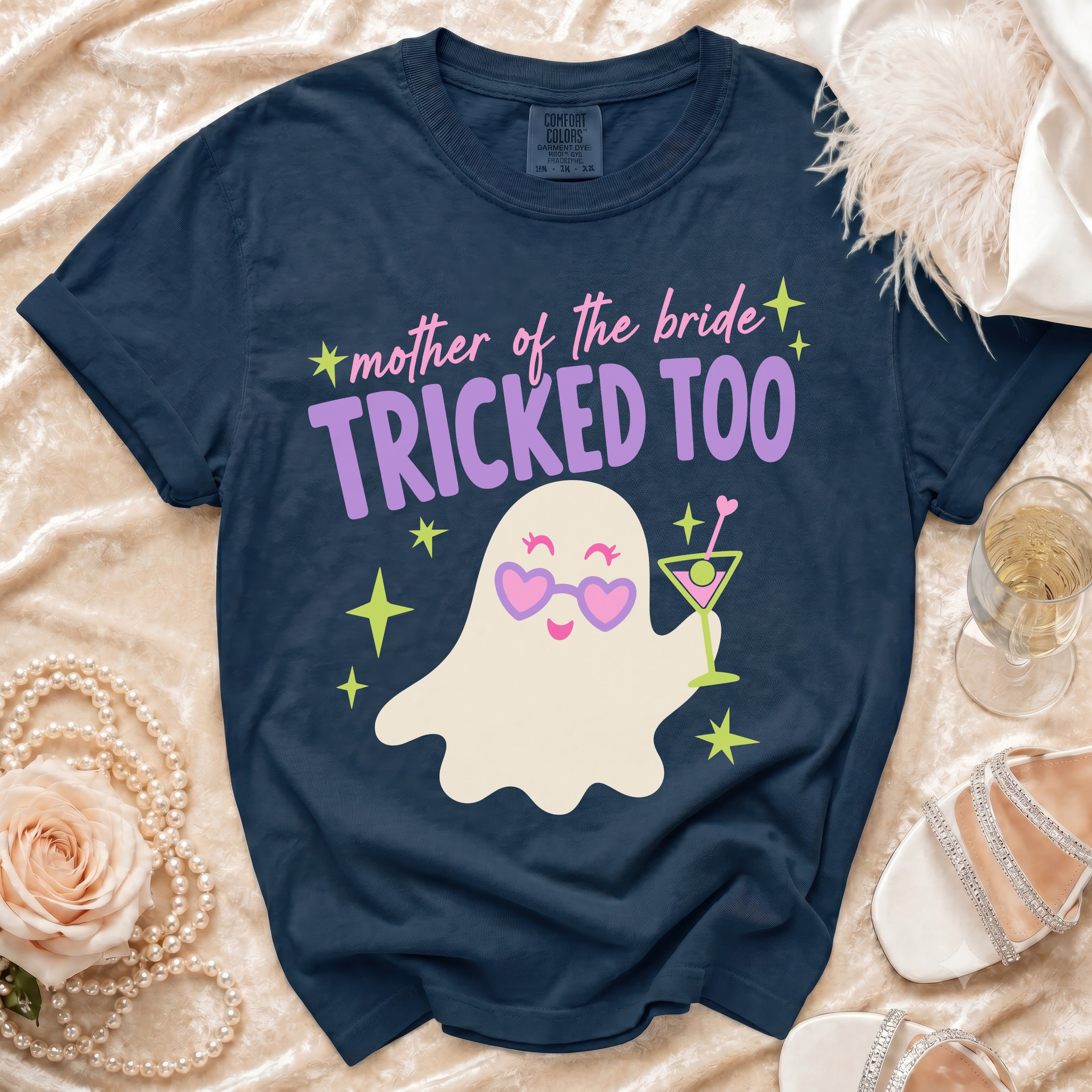 Navy t-shirt with "mother of the bride TRICKED TOO" text and a ghost graphic.