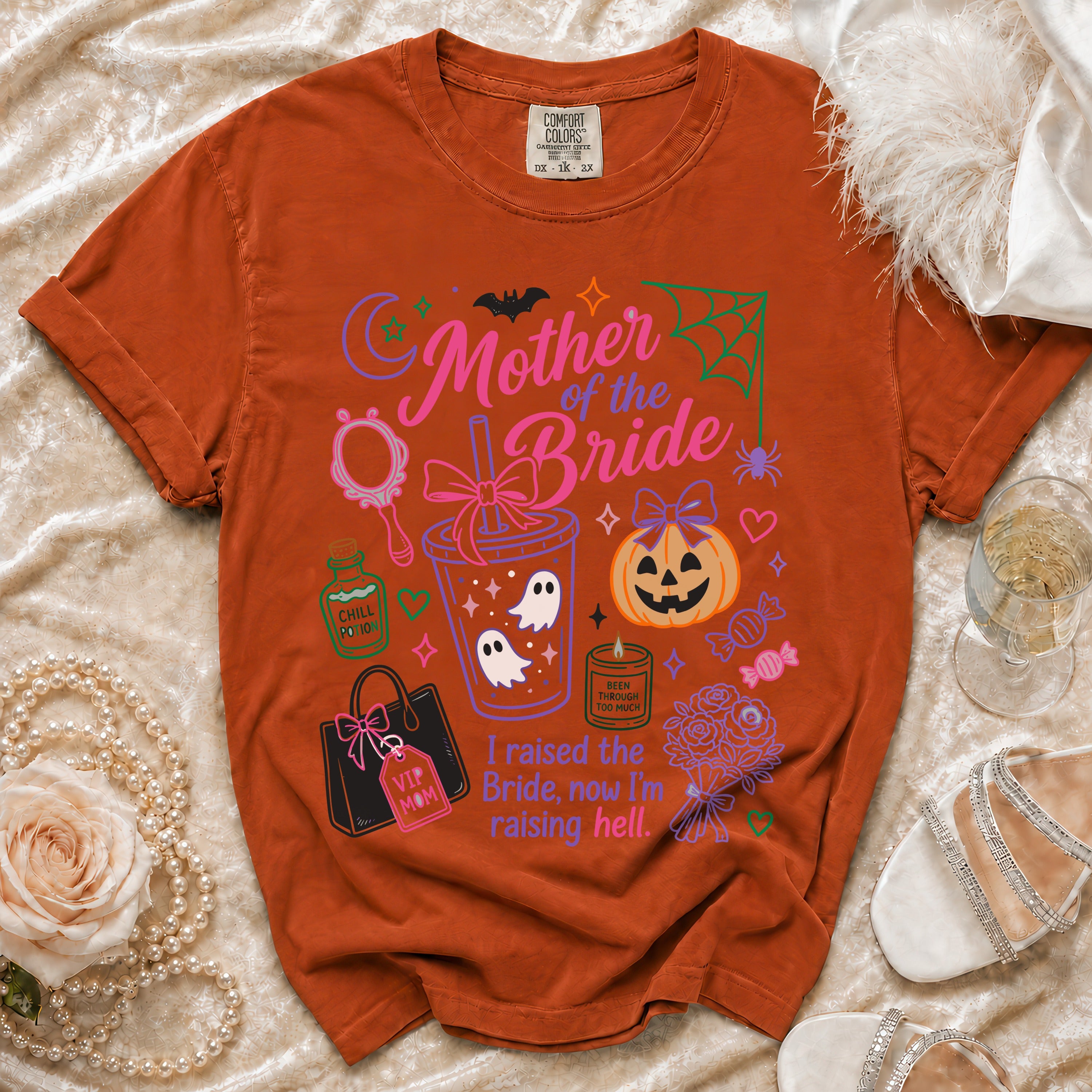 Orange t-shirt with "Mother of the Bride" graphic, ghosts, pumpkin, and text.