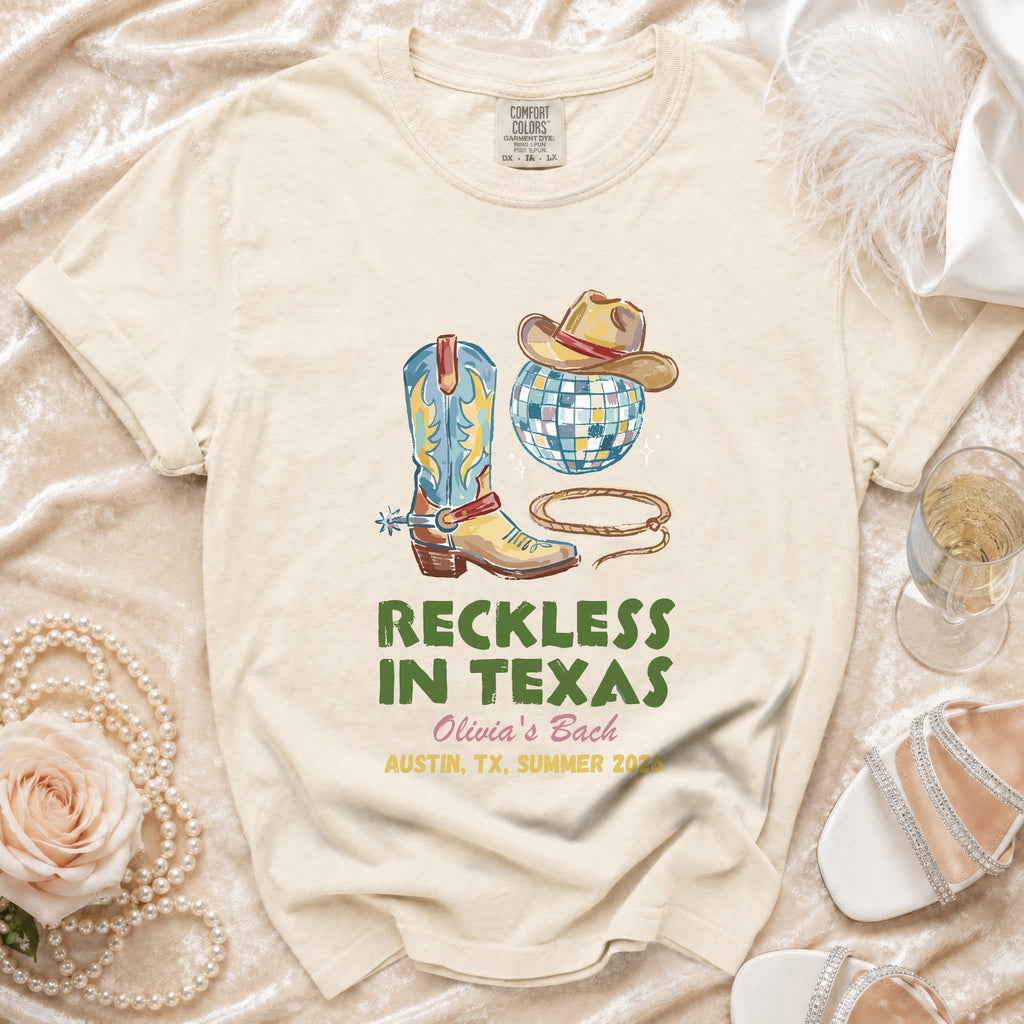 T-shirt with cowboy boots, hat, disco ball, and text "Reckless in Texas Olivia's Bach".