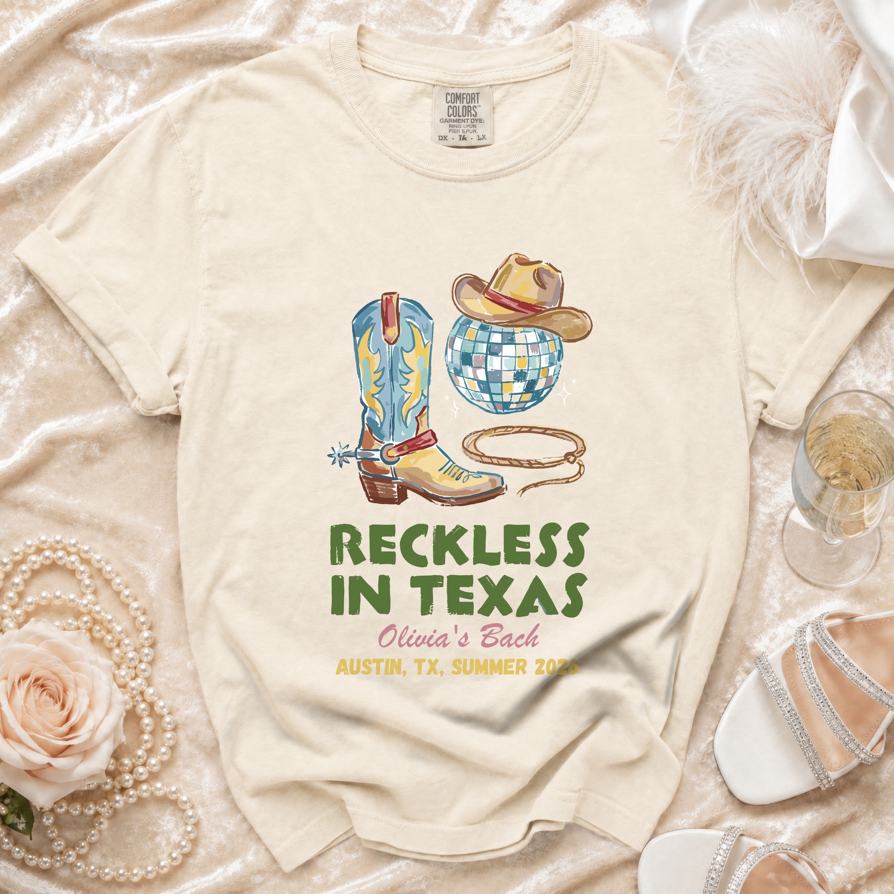 T-shirt with cowboy boots, hat, disco ball, and text "Reckless in Texas Olivia's Bach".