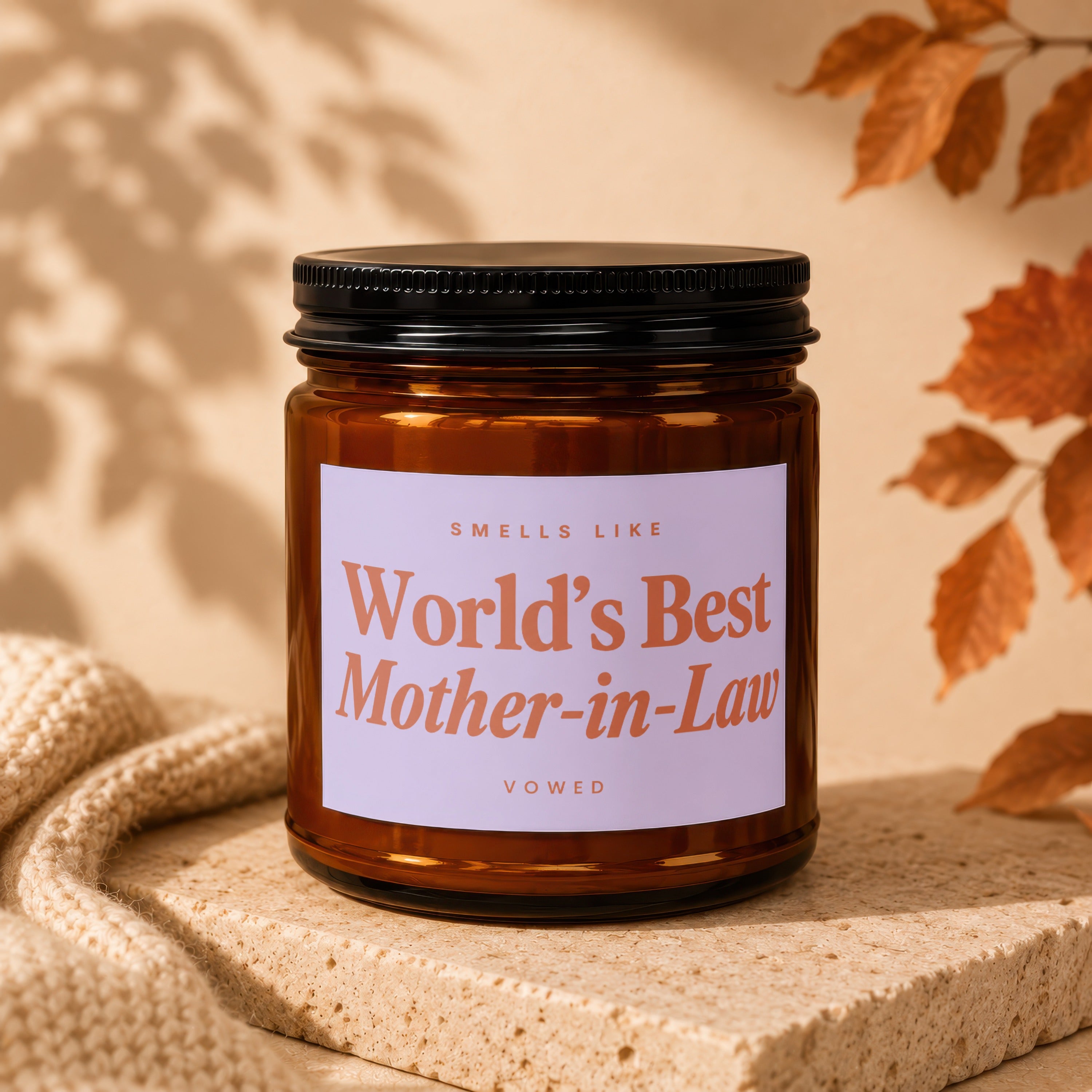 Amber jar candle with label reading "World's Best Mother-in-Law".