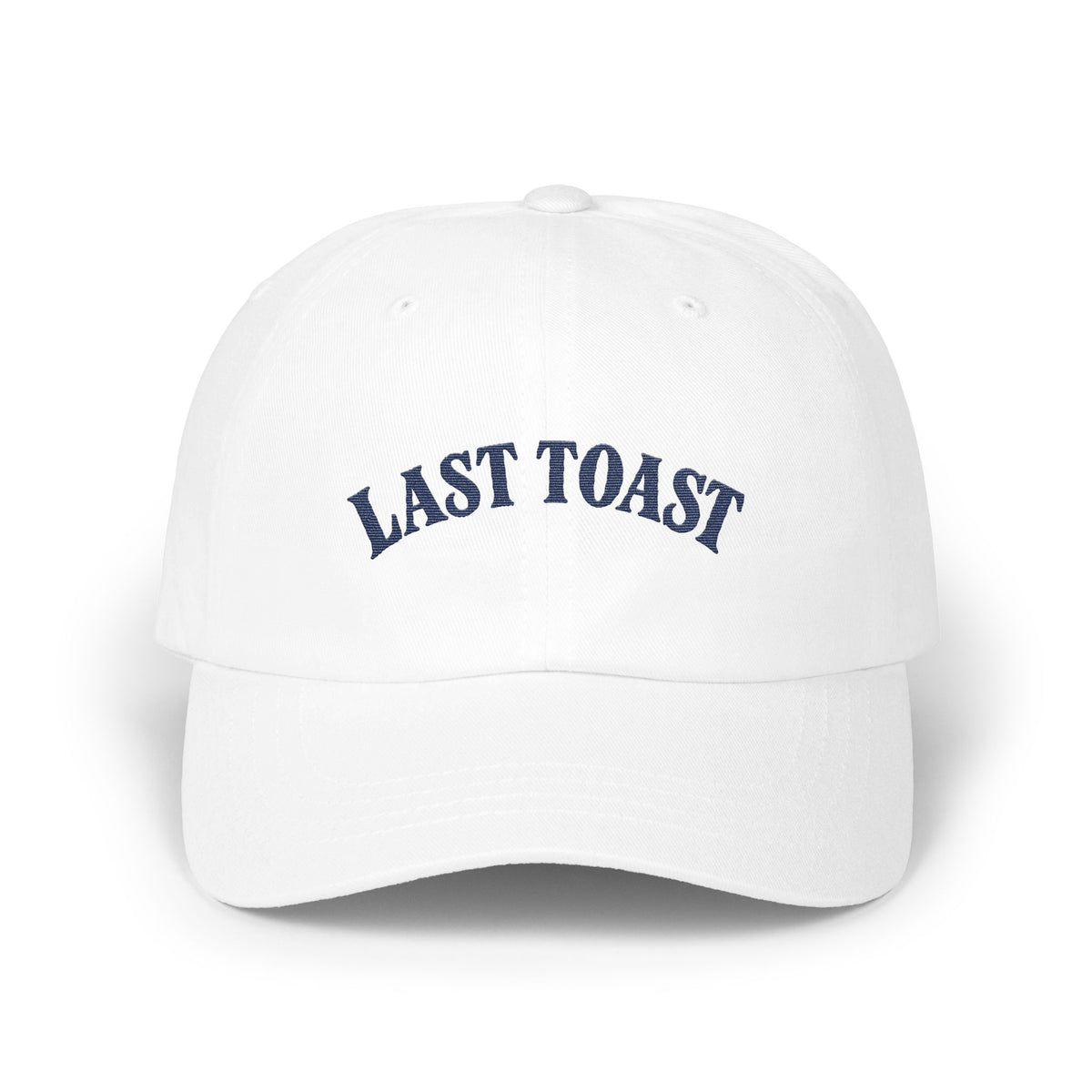White baseball cap with embroidered "LAST TOAST" text in navy blue.