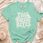 Teal t-shirt with "This Bride Bites" text and vampire-themed graphics.