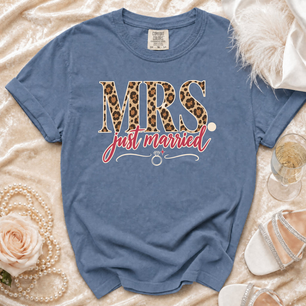 Blue t-shirt with "MRS just married" text in leopard print and script font.