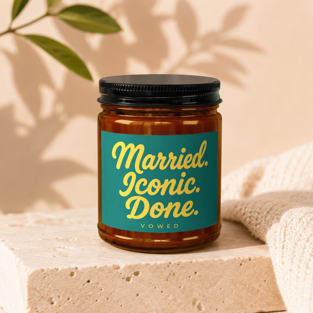 Brown glass jar with black lid, teal label reads "Married. Iconic. Done." and "VOWED".