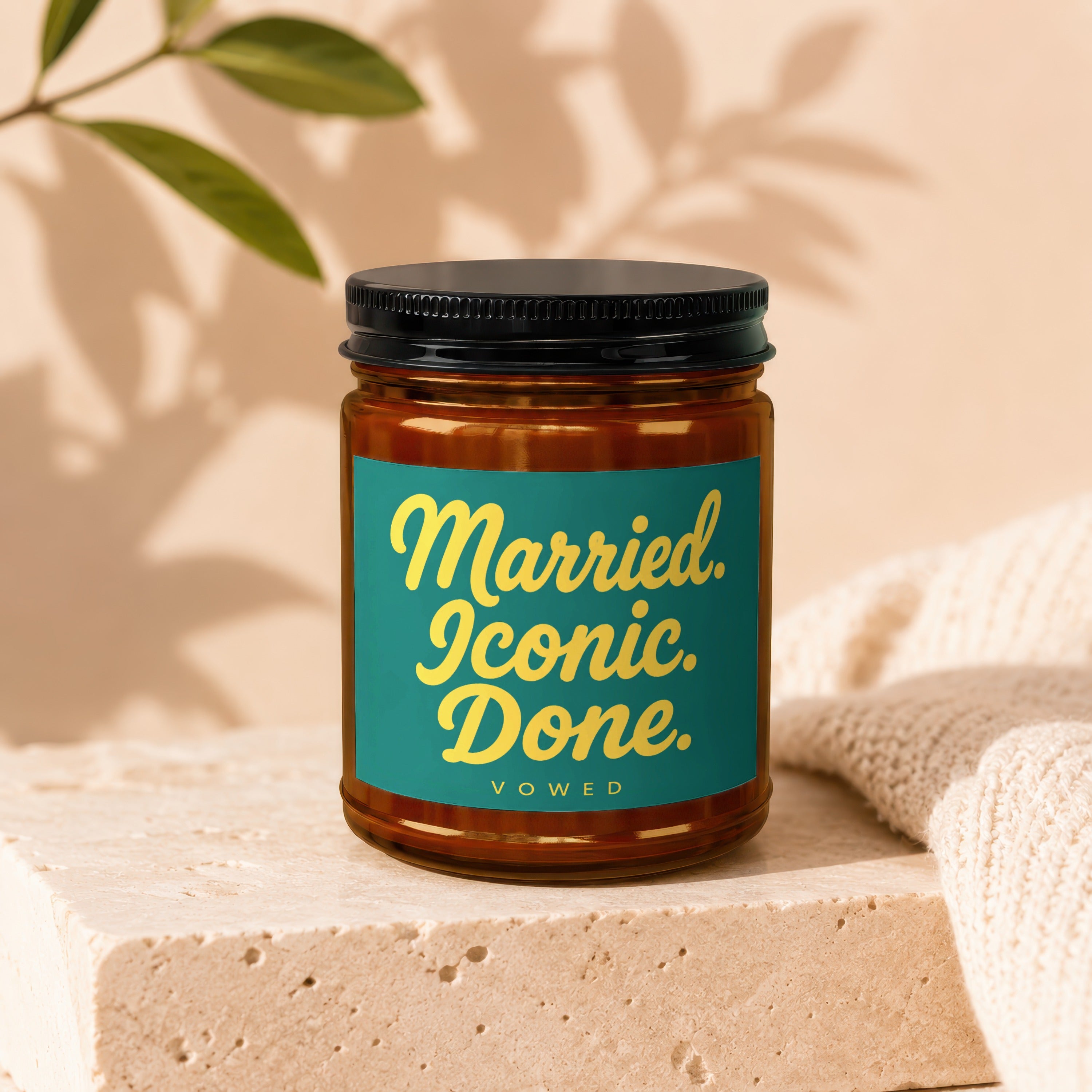 Brown glass jar with black lid, teal label reads "Married. Iconic. Done." and "VOWED".