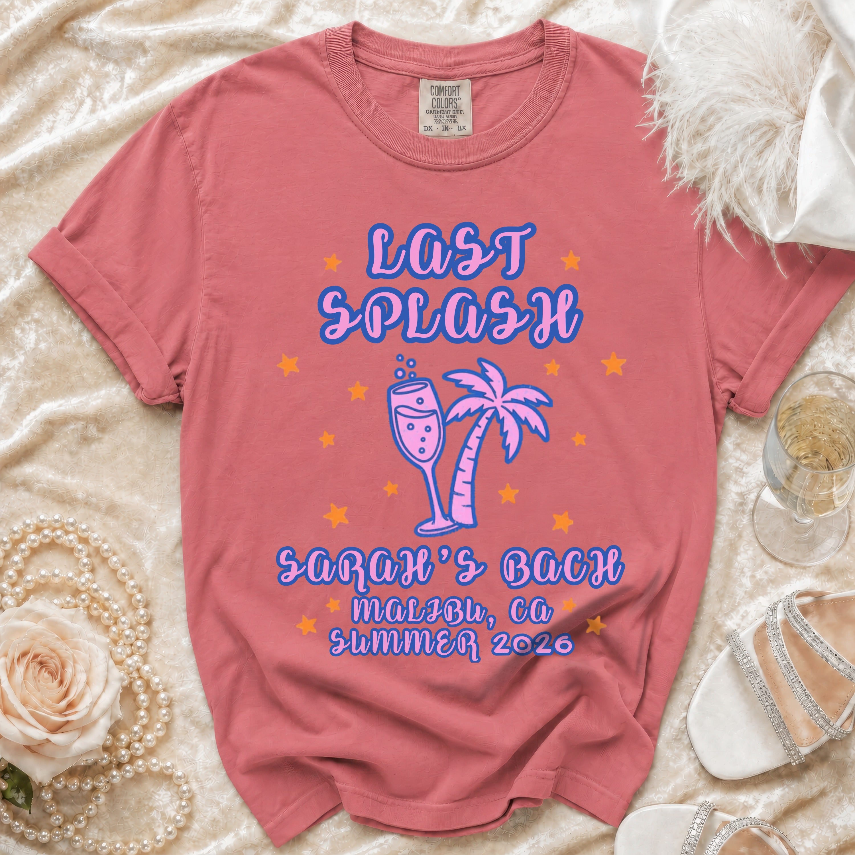 Pink t-shirt with "Last Splash Malibu, CA Summer 2026" text and palm tree graphic.