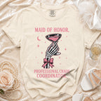 T-shirt with pink text "Maid of Honor, Professional Chaos Coordinator" graphic.
