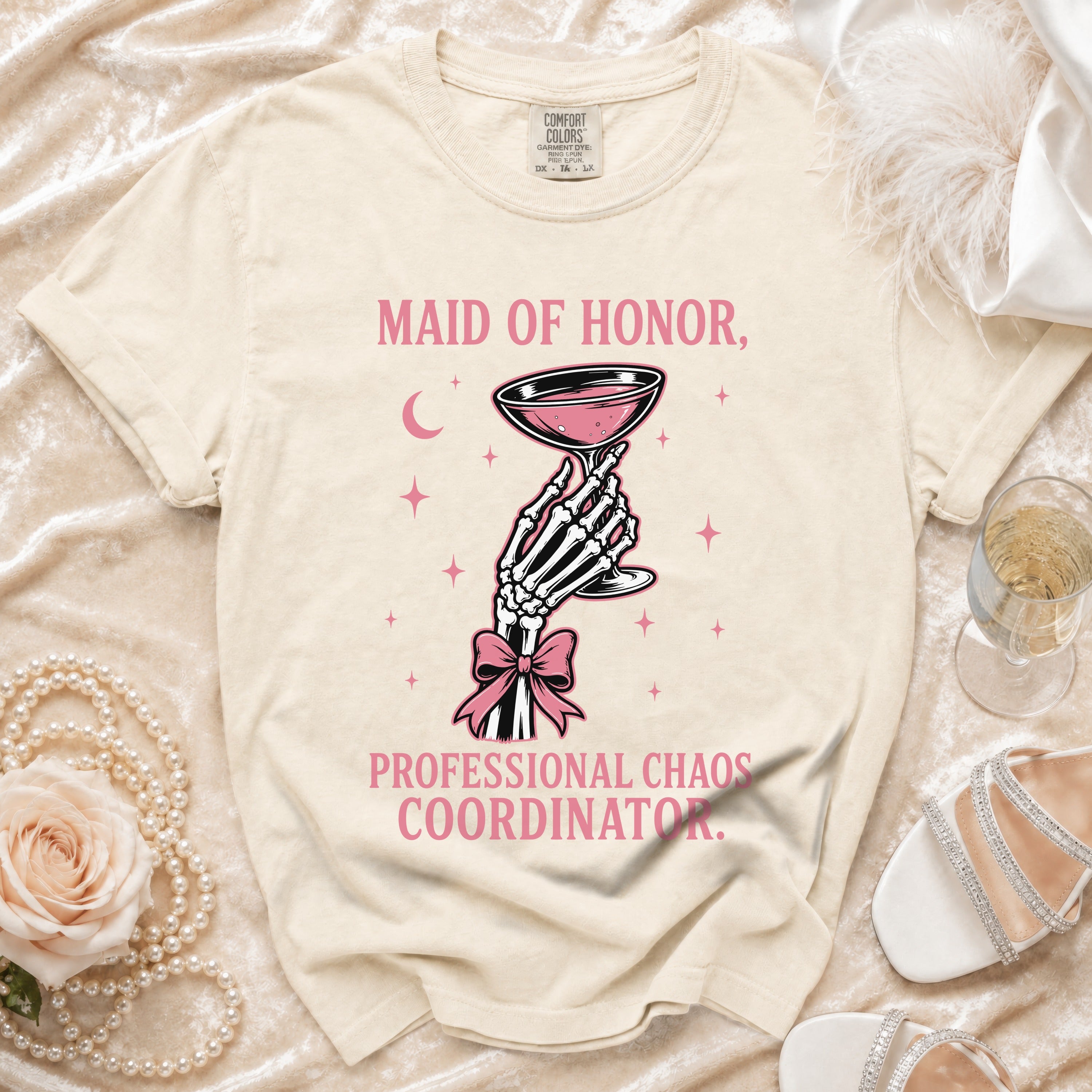 T-shirt with pink text "Maid of Honor, Professional Chaos Coordinator" graphic.