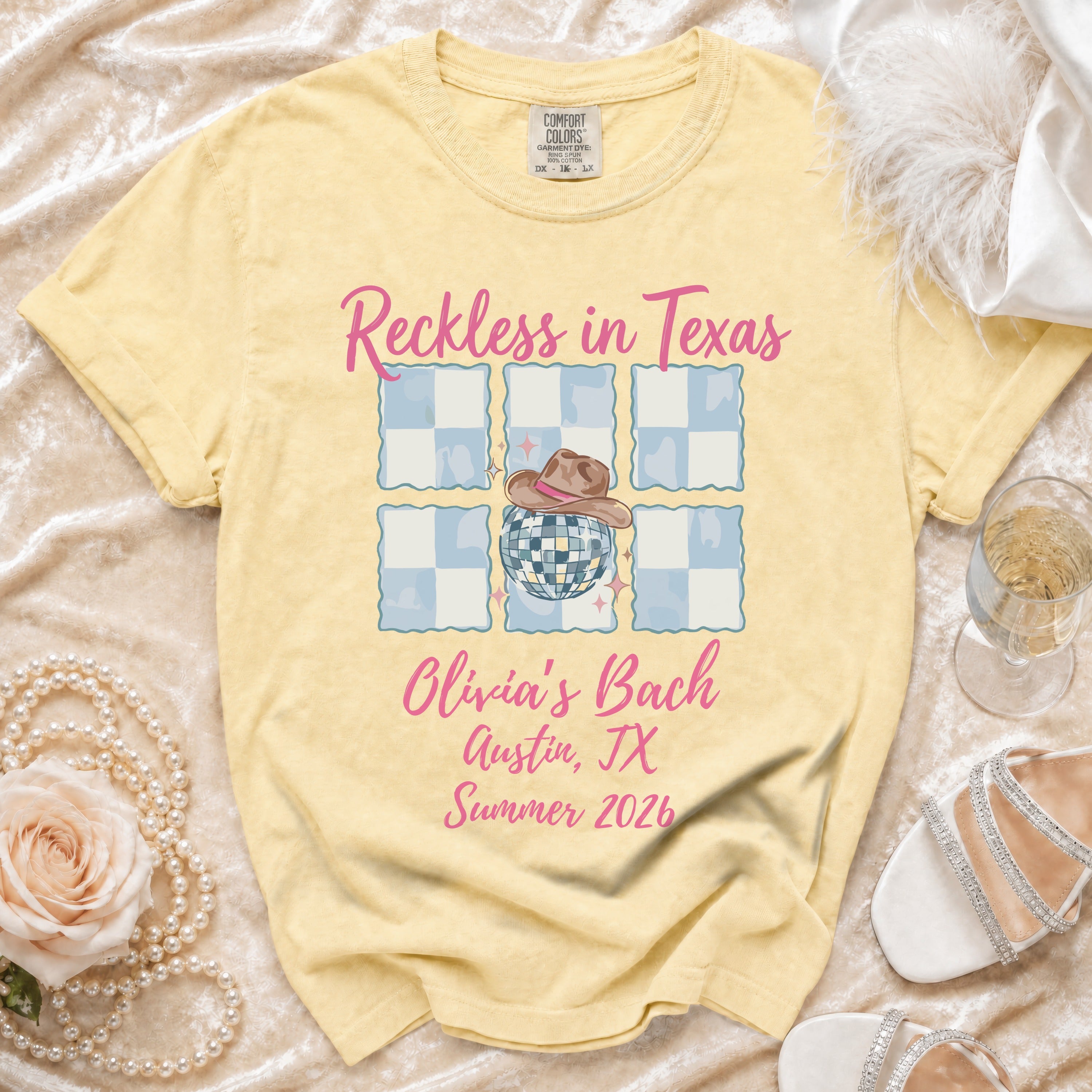 Yellow t-shirt with "Reckless in Texas Olivia's Bach Austin, TX Summer 2026".