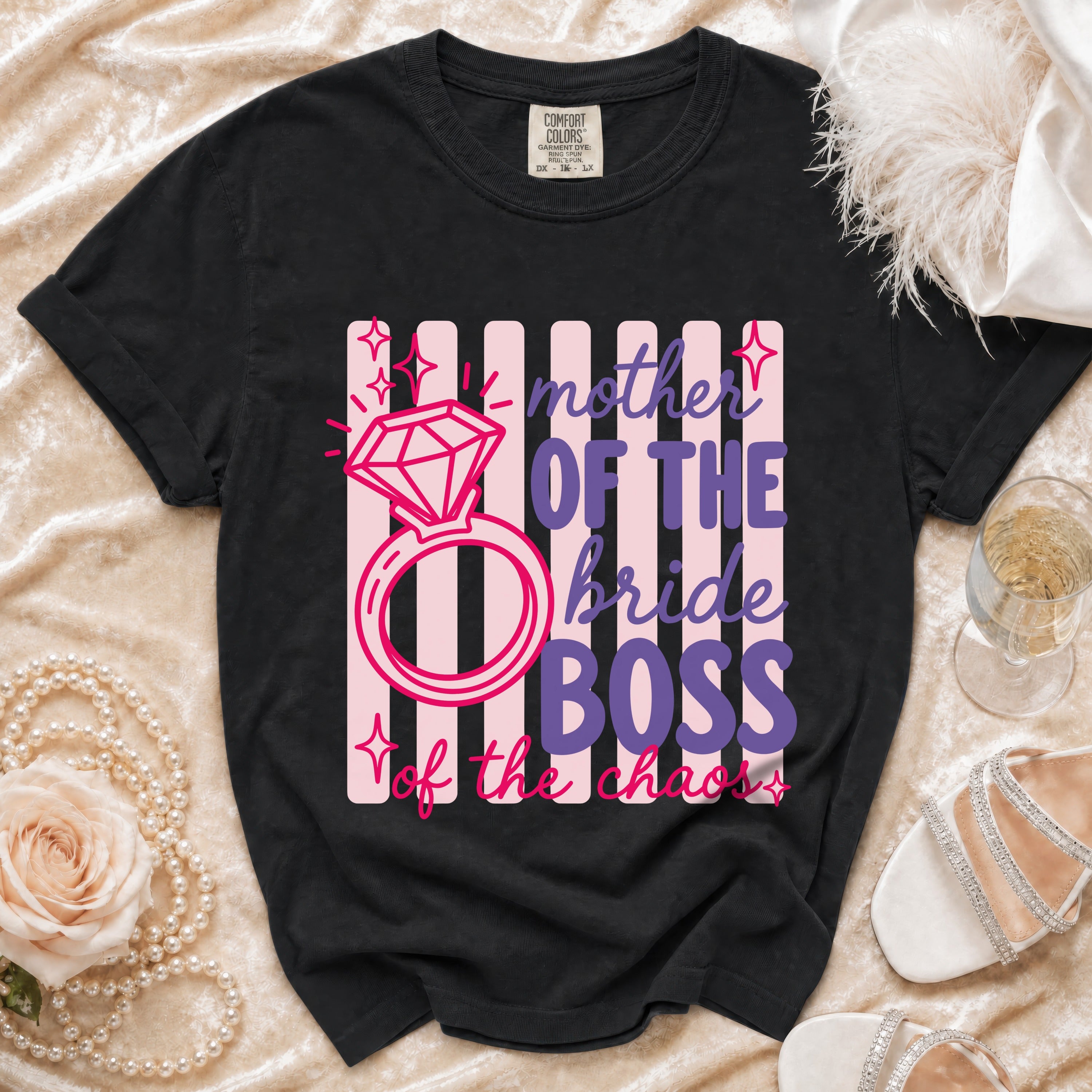 Black t-shirt with "mother of the bride BOSS of the chaos" graphic.