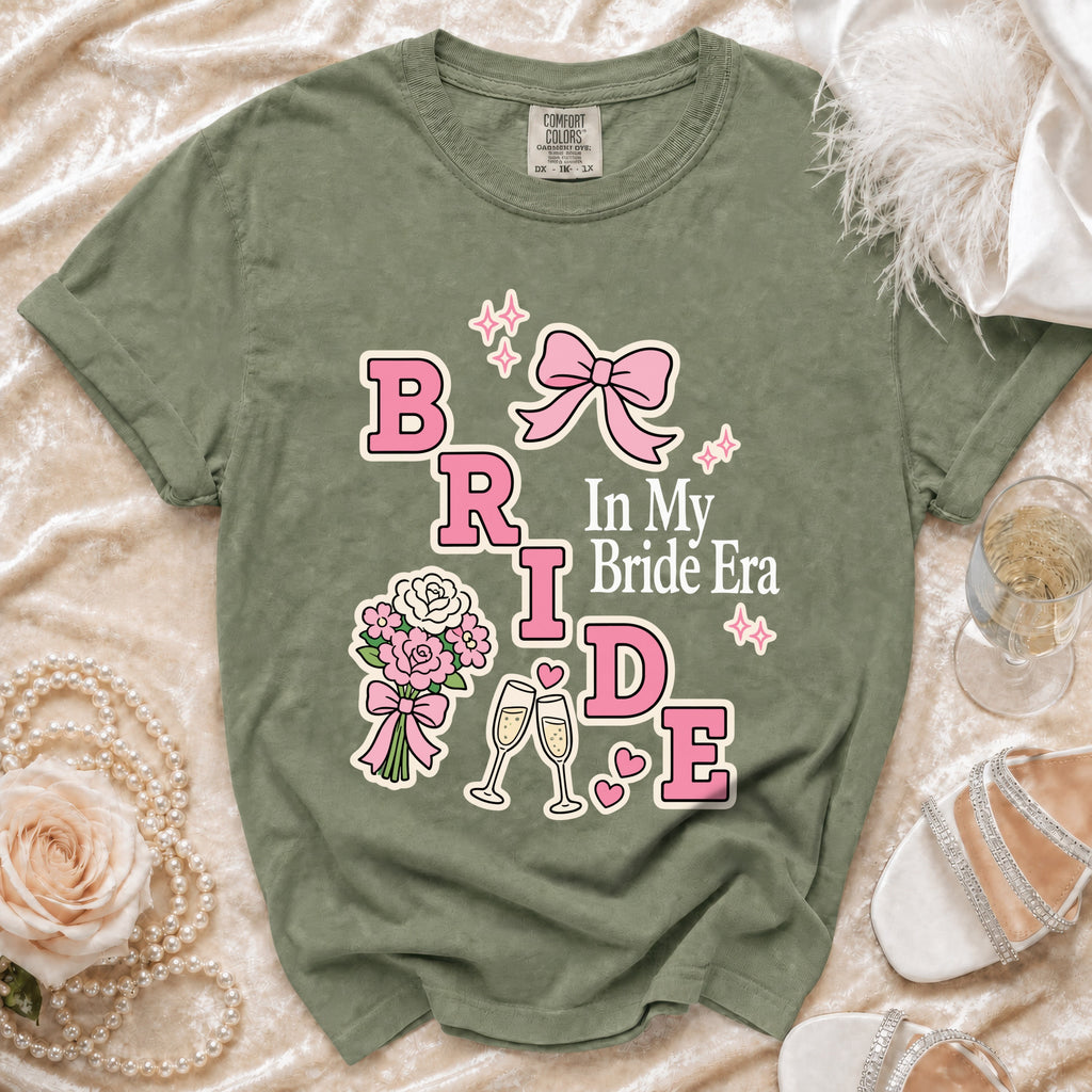Green t-shirt with "BRIDE In My Bride Era" graphic featuring pink lettering and accents.