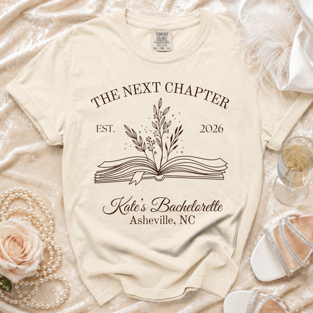 Cream t-shirt with "The Next Chapter" graphic, "Kate's Bachelorette Asheville, NC".