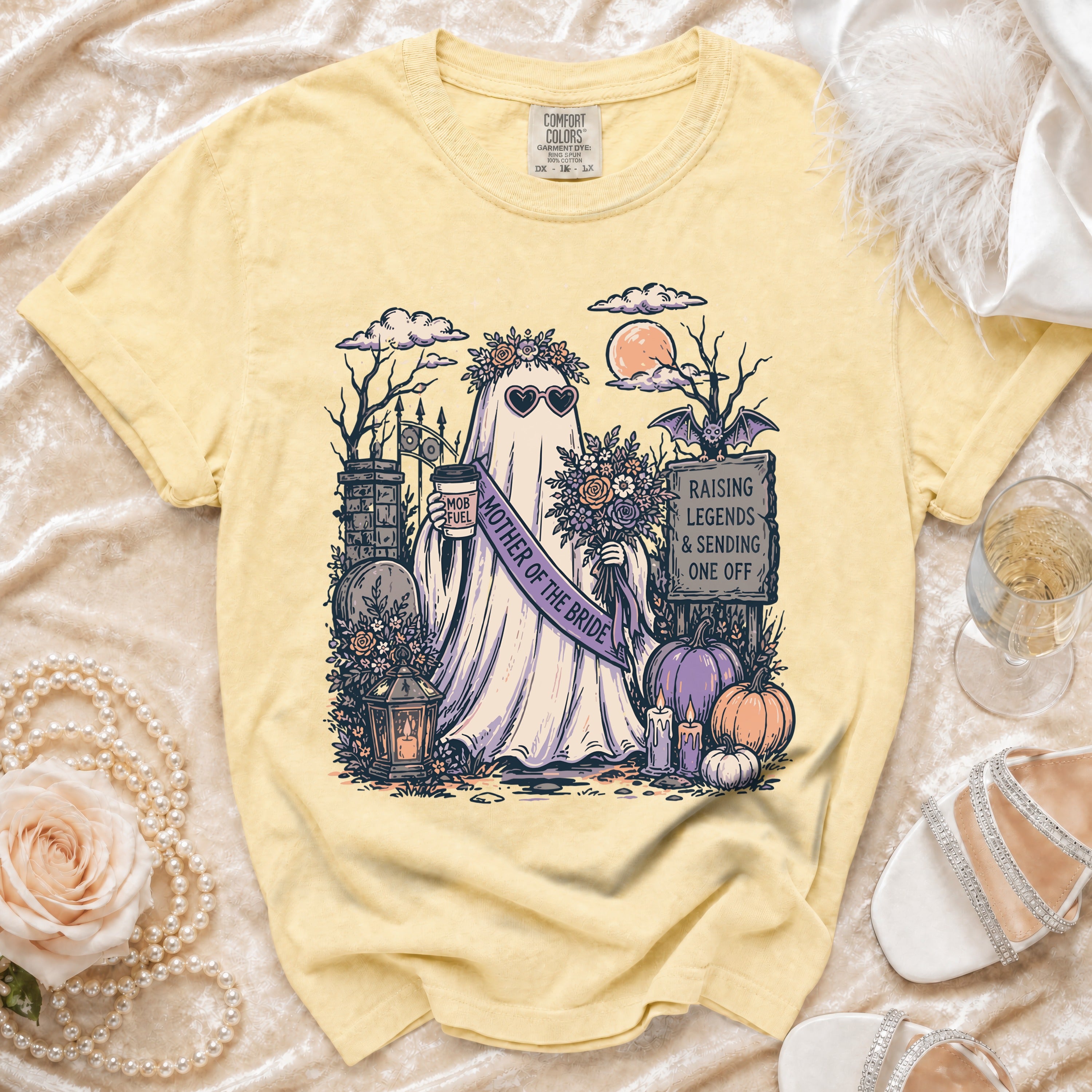 Yellow t-shirt with ghost graphic: "Mother of the Bride" and spooky graveyard scene.