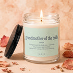 Glass candle labeled "grandmother of the bride" with lit wick.