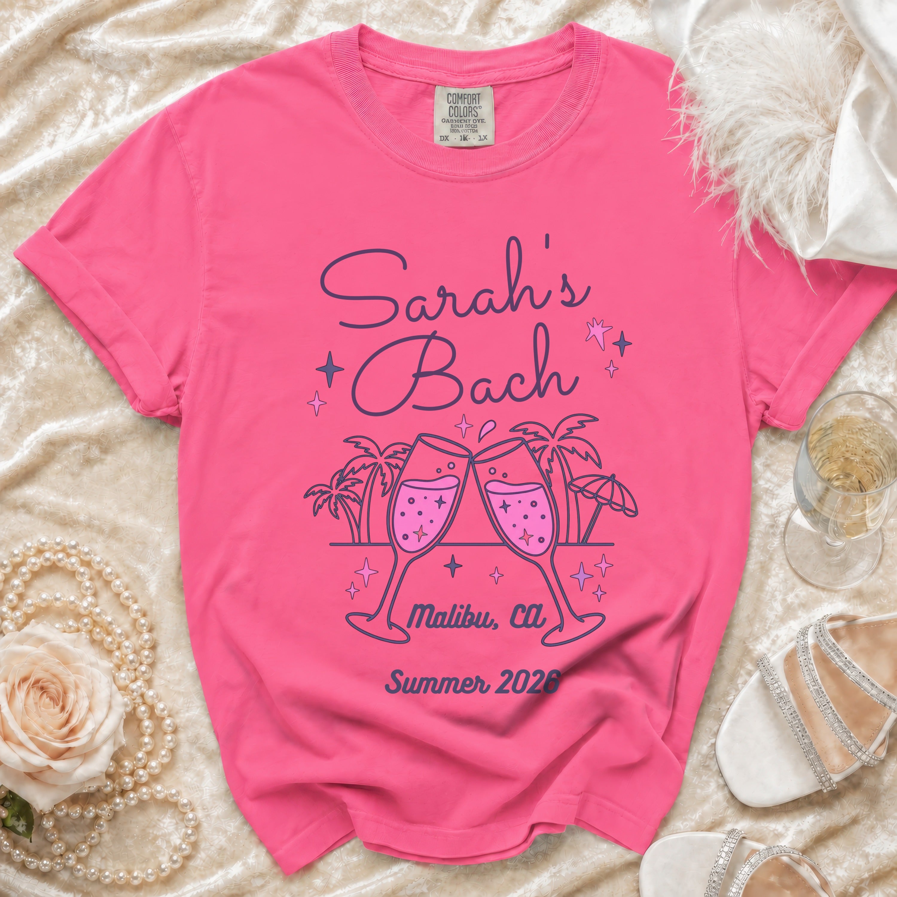 Bright pink t-shirt for Sarah's Bach in Malibu, CA, Summer 2026.