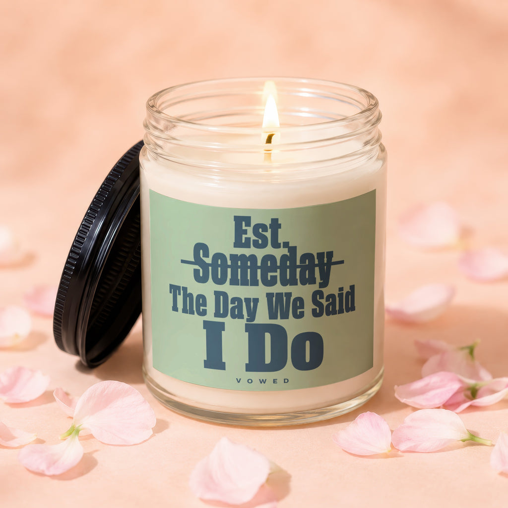 Jar candle with lit wick and "Est. Someday The Day We Said I Do" text.