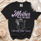 Black t-shirt with "Mother of the Bride I Do The Boo-Thing" text and ghost graphic.