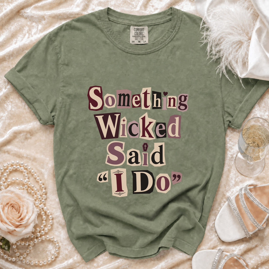 Sage green t-shirt with "Something Wicked Said I Do" text in collage font.