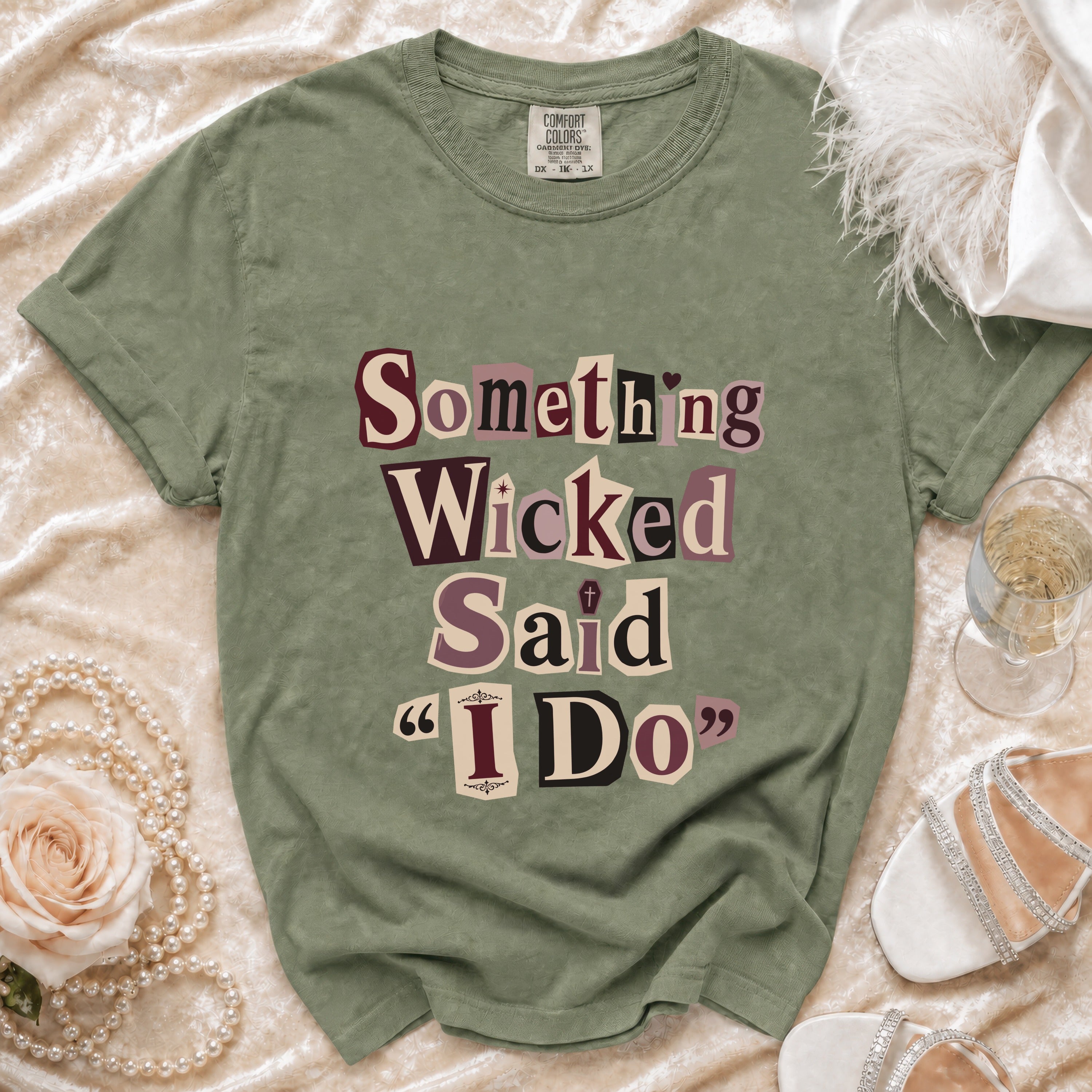 Sage green t-shirt with "Something Wicked Said I Do" text in collage font.