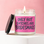 Glass candle with pink label and text "ONLY HOT B*TCHES ARE BRIDESMAIDS".