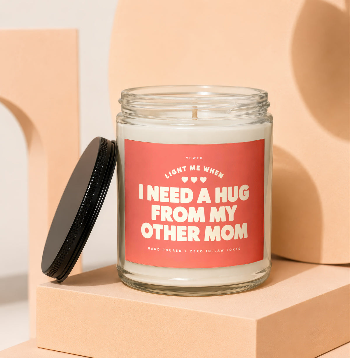 Glass candle with red label: "Light me when I need a hug from my other mom."