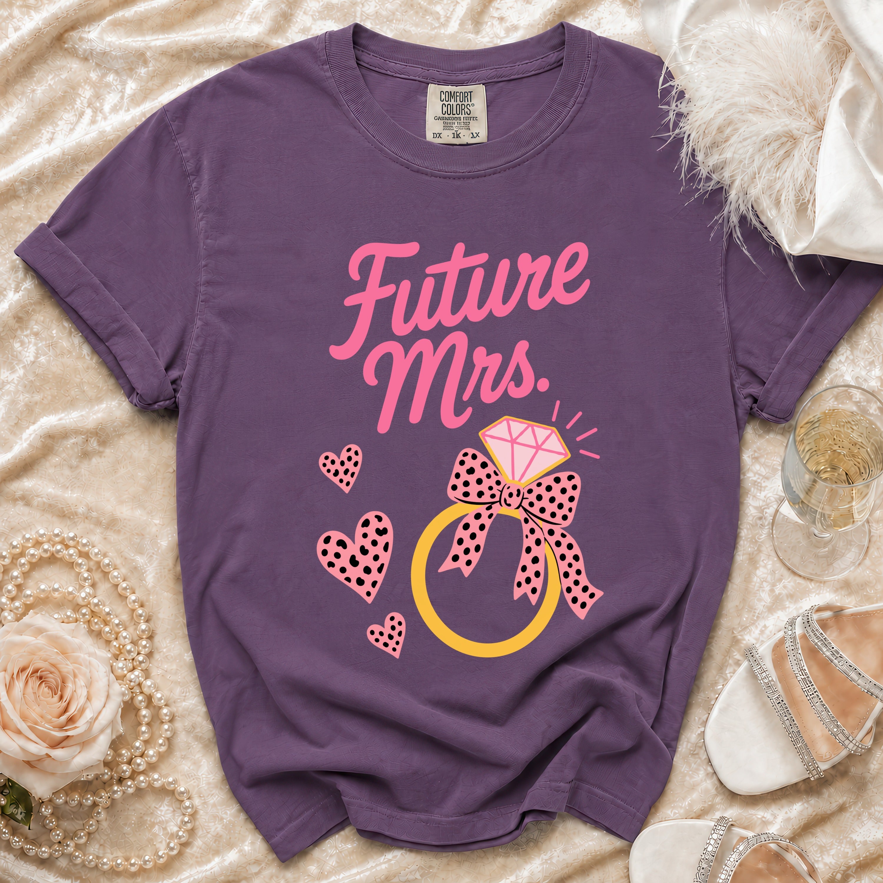 Purple t-shirt with "Future Mrs." text, diamond ring, and pink hearts.