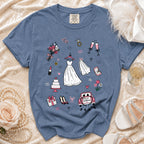 Blue t-shirt with wedding-themed illustrations: dress, rings, cake, flowers, and car.