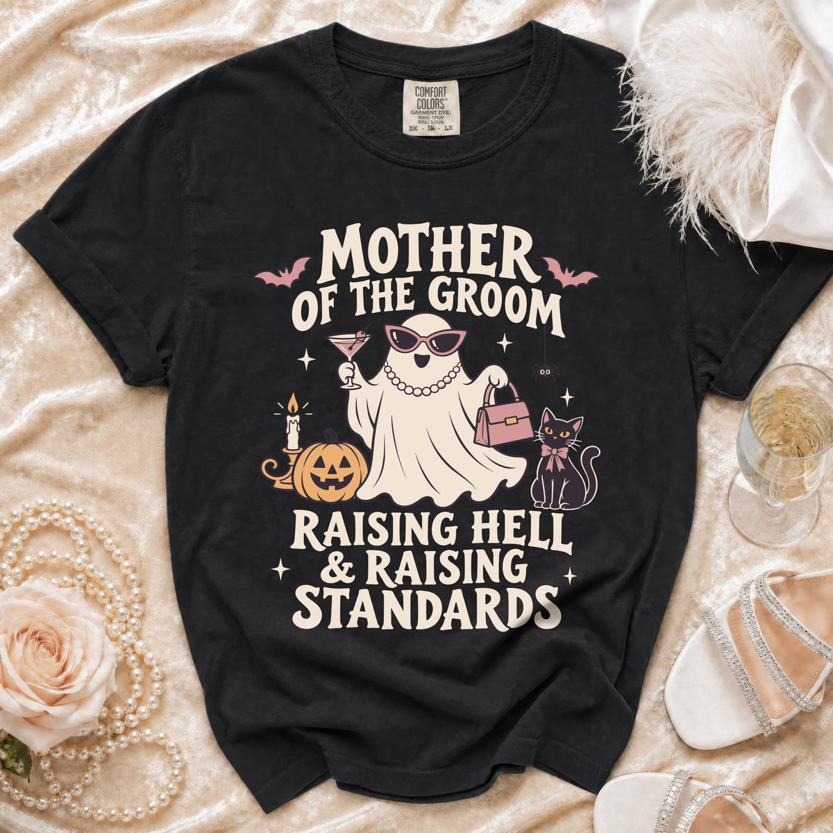 Black t-shirt with "Mother of the Groom Raising Hell & Raising Standards" text and graphics.