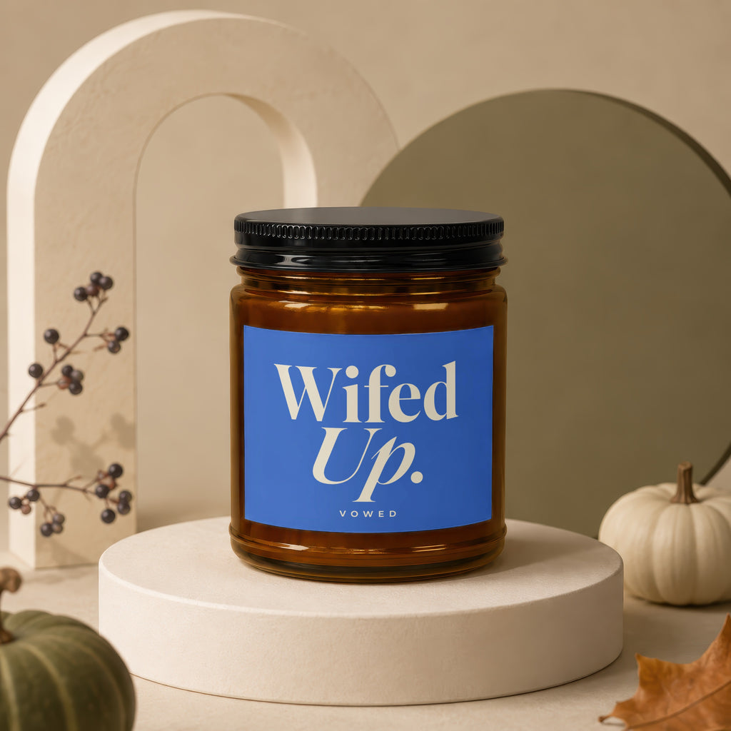 Amber jar candle, "Wifed Up." text on blue label, with pumpkins and autumn decor.