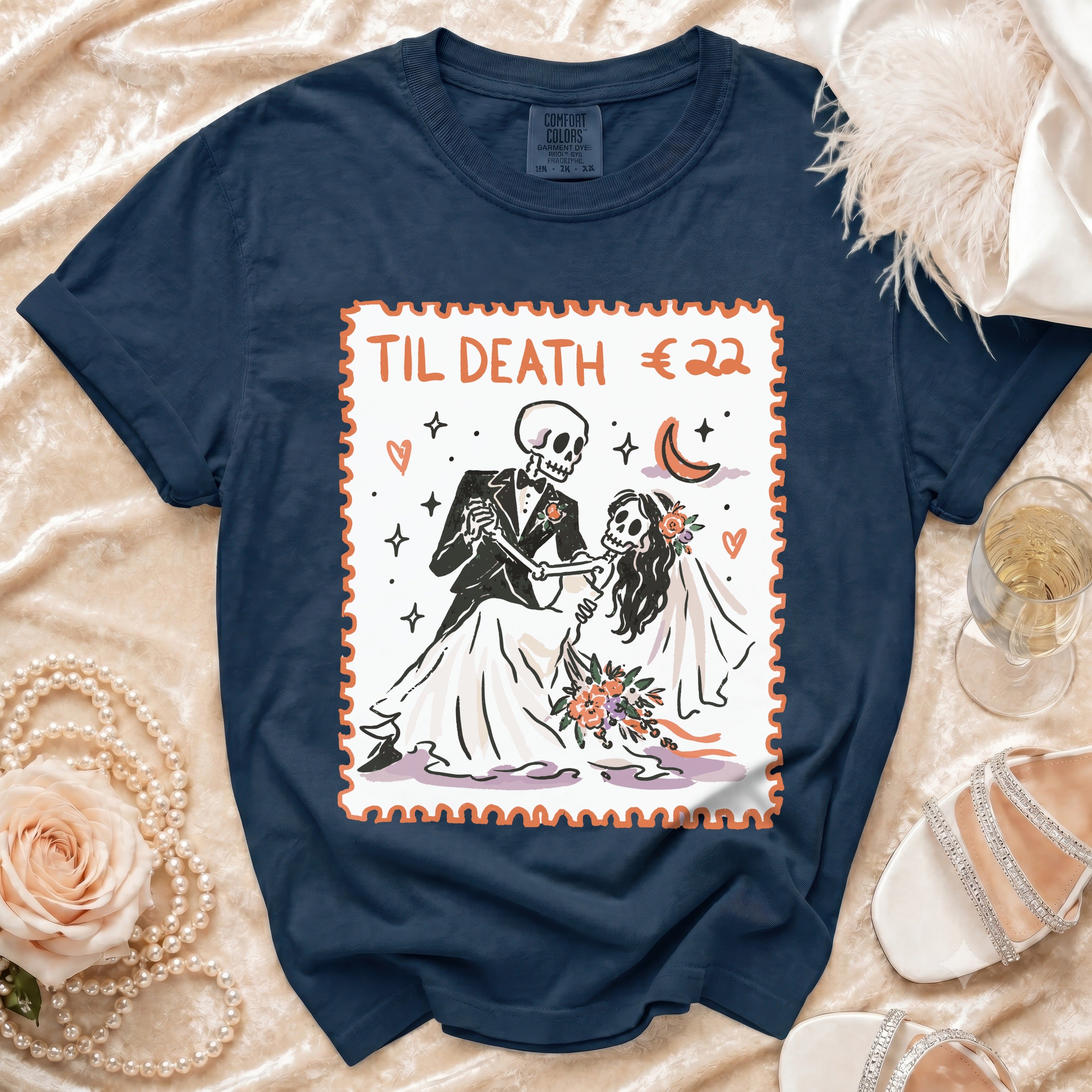 Navy t-shirt with "Til Death" skeleton bride and groom graphic in a stamp design.