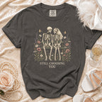 Dark grey t-shirt with skeleton couple illustration and text "STILL CHOOSING YOU".