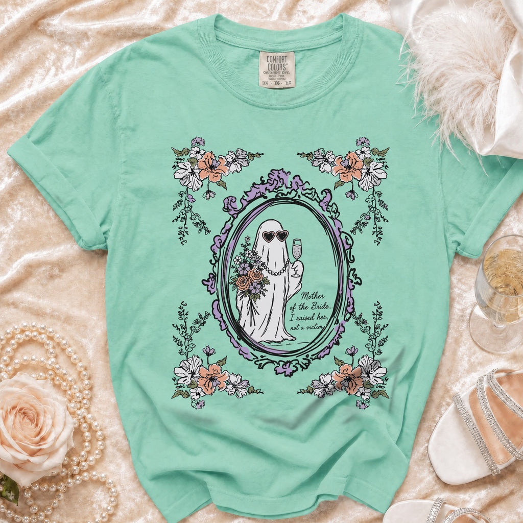 Mint green t-shirt with ghost graphic reading "Mother of the Bride... I raised her, not a victim."