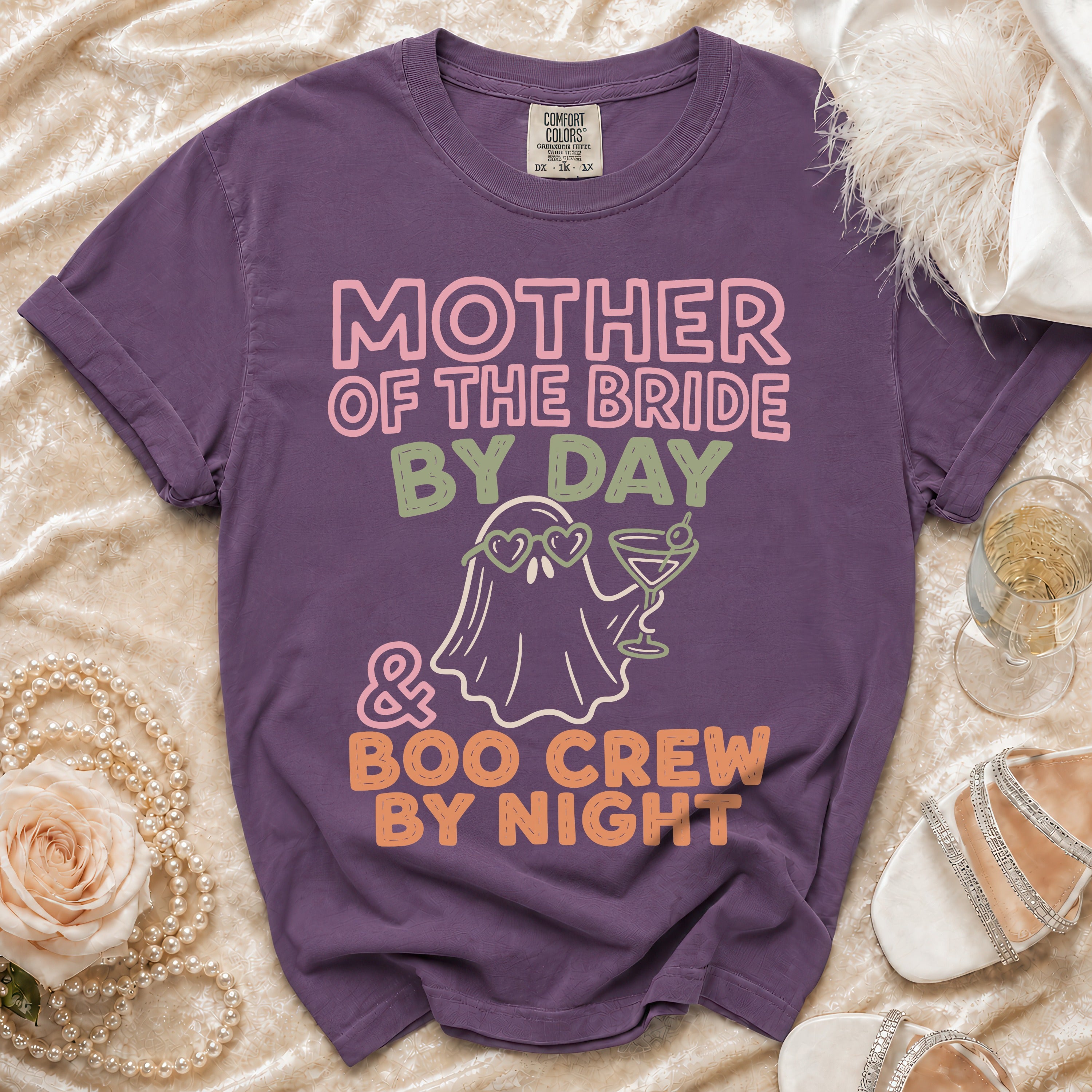 Purple t-shirt with "Mother of the Bride By Day & Boo Crew By Night" text and ghost graphic.