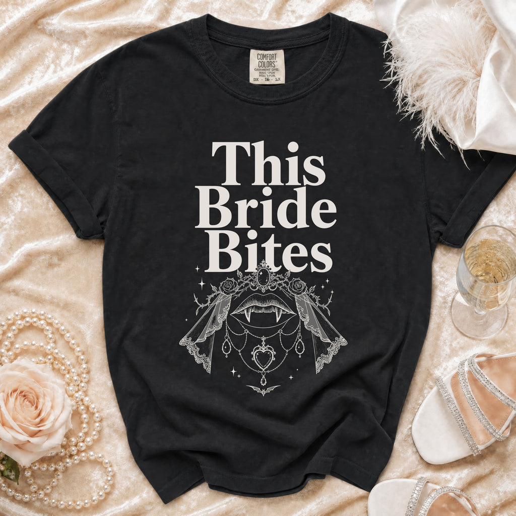 Black t-shirt with "This Bride Bites" text and vampire lips graphic.