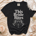Black t-shirt with "This Bride Bites" text and vampire lips graphic.