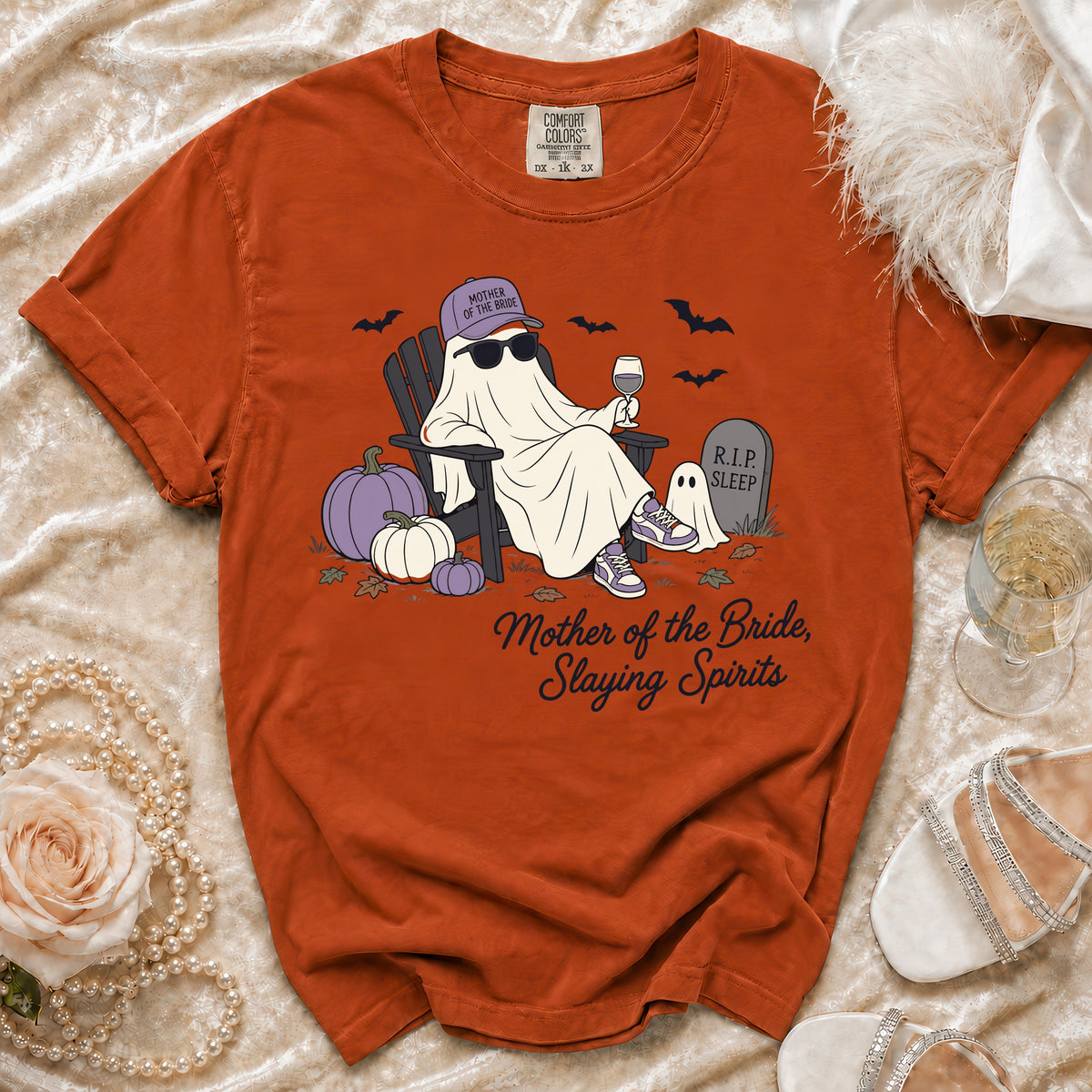 Orange t-shirt with a ghost wearing a "Mother of the Bride" cap and sunglasses.