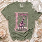 Green t-shirt with "Maid of Honor Chaos" text and champagne illustration.