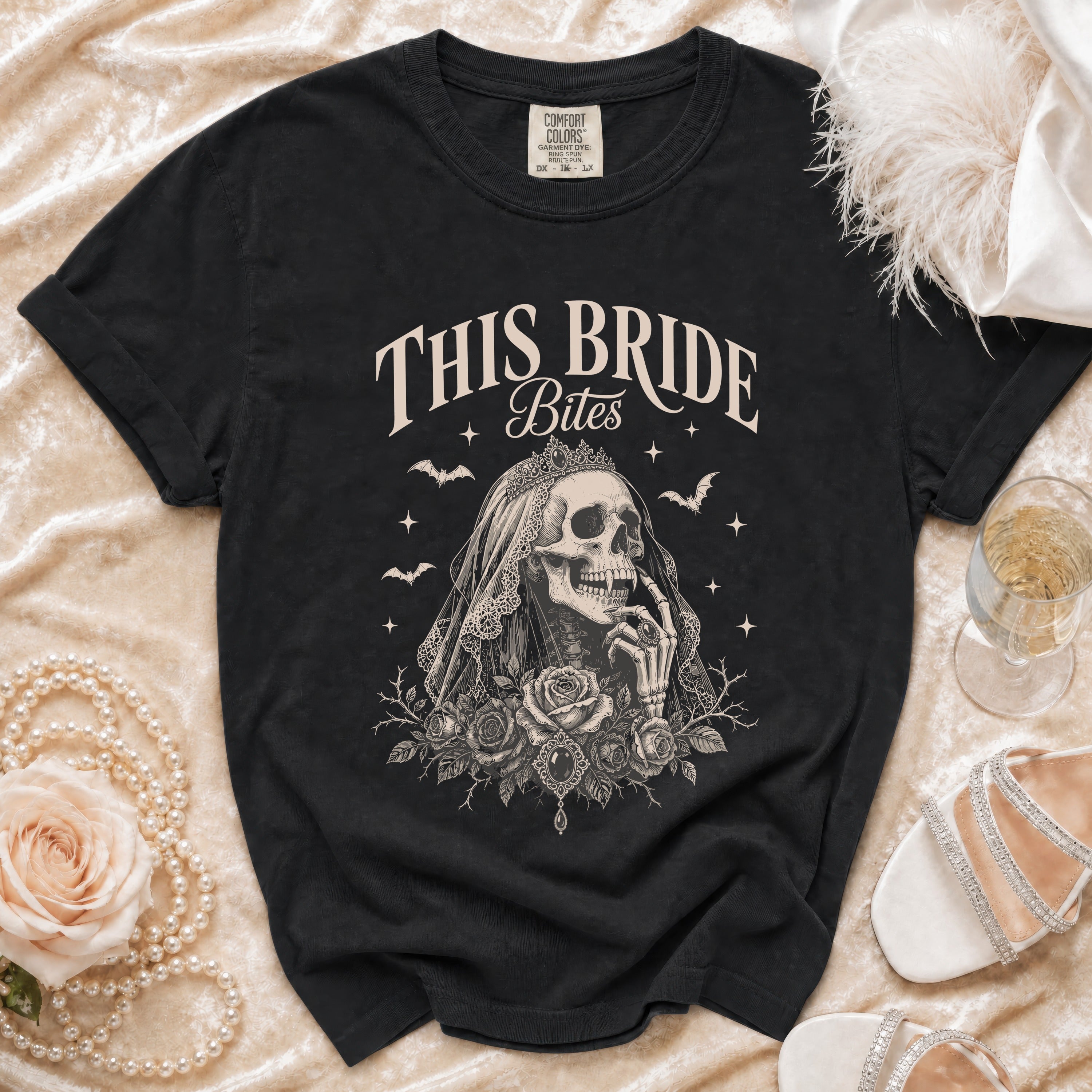 Black t-shirt with "This Bride Bites" text and skeleton bride graphic.