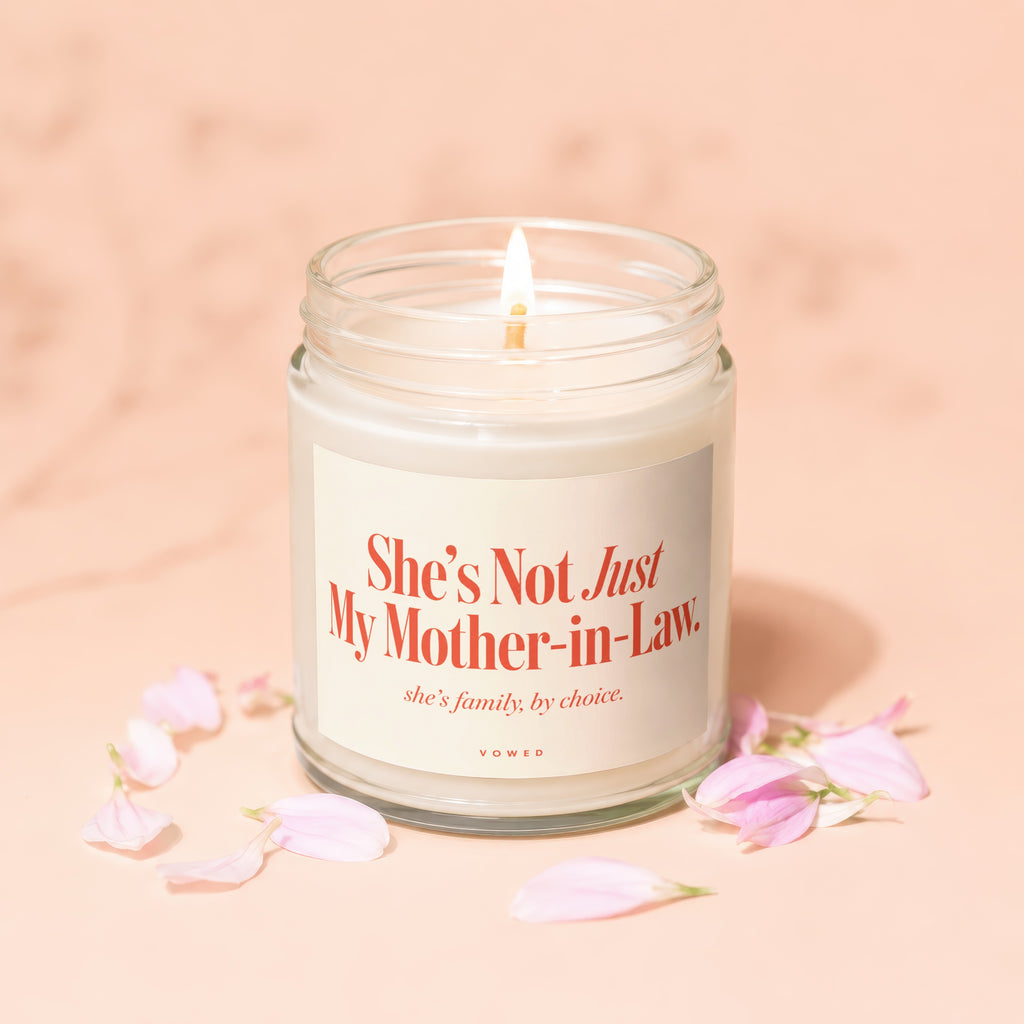 Candle with text "She's Not Just My Mother-in-Law. she's family, by choice. VOWED"